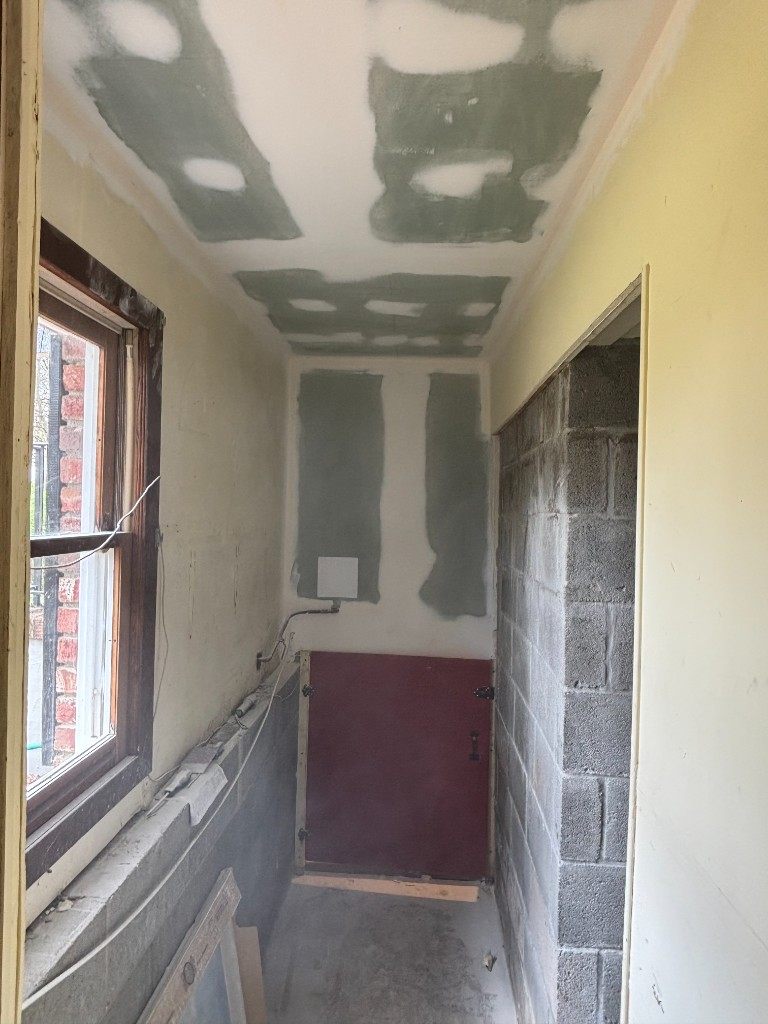 Hallway drywall and red access door